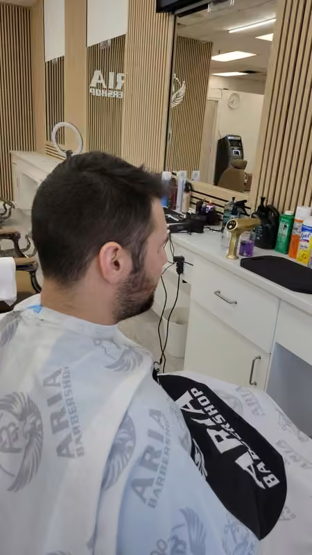 Inside Aria Barbershop with modern barber station